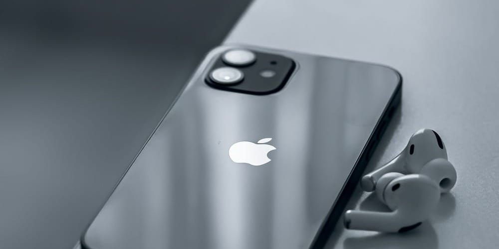 silver iphone 6 on white table